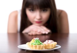 Dieting woman craving for cake