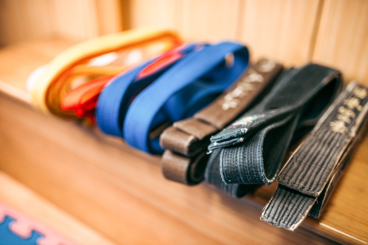 Martial arts, brown, orange, blue and black belts closeup
