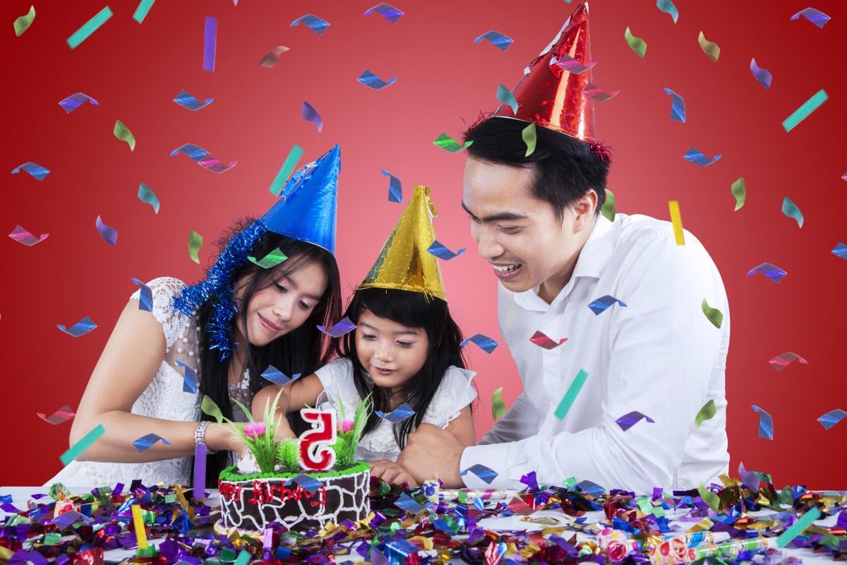 Sweet girl cuts birthday cake