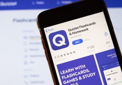 Los Angeles, California, USA - March 24, 2020: Quizlet flashcards and homework app logo on phone screen close up with website on background with icon, illustrative editorial.